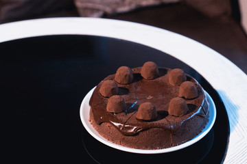 Tasty chocolate cake on table