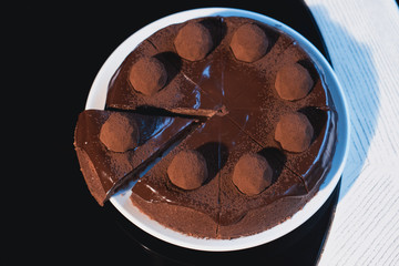 Tasty chocolate cake on table