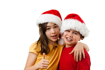 Christmas time - girl and boy with Santa Claus Hat showing OK sign