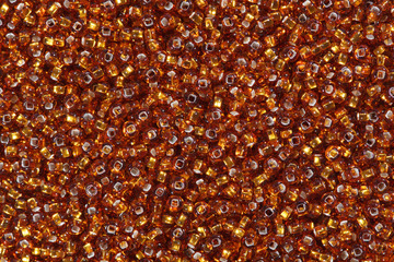 Orange red seed beads.