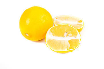 Two meyer lemons isolated on white background