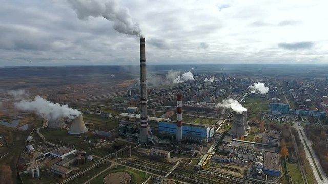 Pollution industry. Smoking power plant in a huge industrial area. 4K.