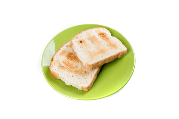 Two whole grain slices of bread toasted on a ceramic plate isolated on white background