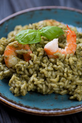 Close-up of spinach and tiger shrimps risotto, studio shot
