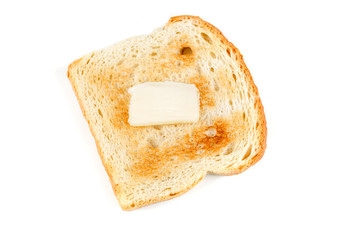 Toasted whole grain bread with a pat of butter isolated on white background