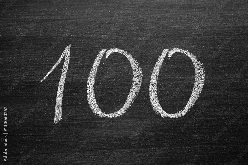 Wall mural number one hundred enumeration written with a chalk on the blackboard