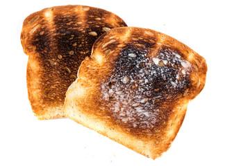 Burned whole grain toast isolated on white background