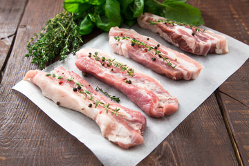 Raw meat. Pork ribs with herbs and spices