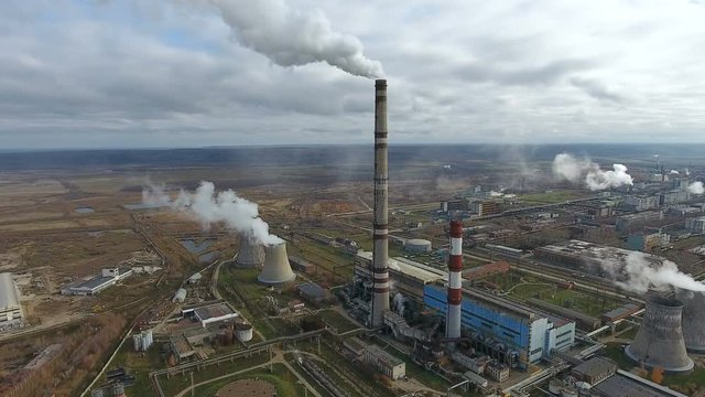 Pollution industry. Smoking power plant in a huge industrial area. 4K.