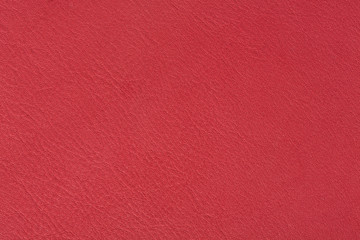 Bright red leather texture, abstract background.