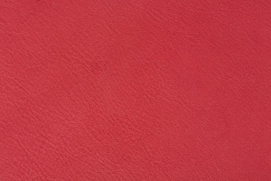 Bright red leather texture, abstract background.