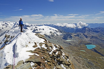 Climber on the summit of the Matterhorn, 4478m, Zermatt, Valais, Swiss Alps