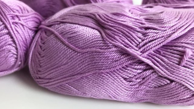 Shallow DOF skeins of knitting wool dolly 4K 2160p 30fps UltraHD footage - Pink yarn of wool wrapped in loose twist 3840X2160 UHD video 