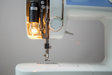 Sewing machine on empty background