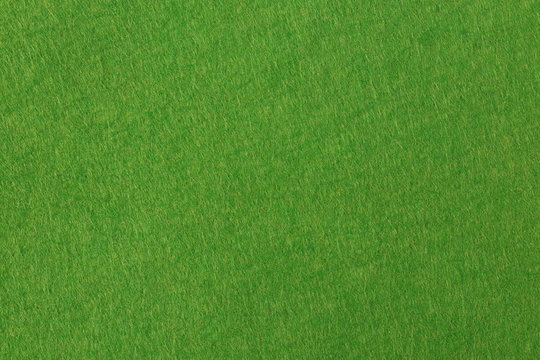 Green felt background based on natural texture.