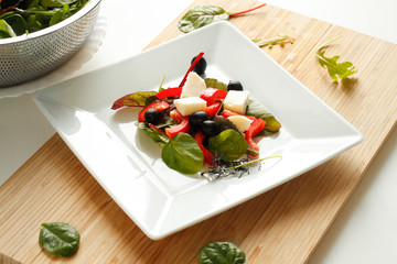 Healthy greek salad with balsamic sauce