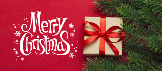 Branches of a Christmas tree with the wishes of Merry Christmas 