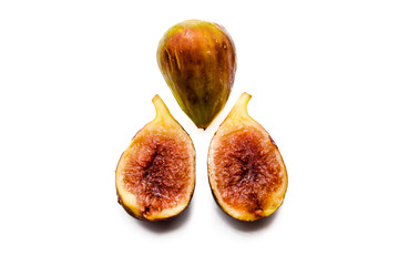 Close up view of figs on white table background