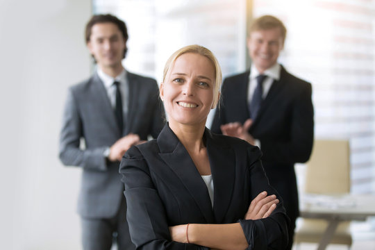 Businesswoman in center of group