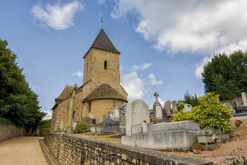 Fototapeta na wymiar Village church and cemetery in France