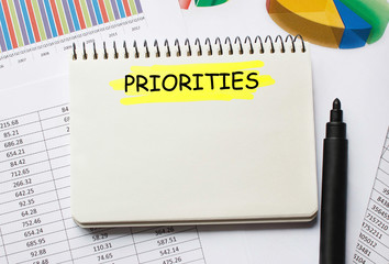 Notebook with Toolls and Notes about Priorities