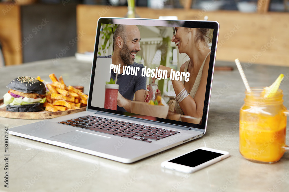 Poster workplace of freelancer or self-employed person with open generic laptop computer, fresh juice, burg