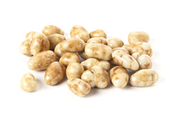 Candied pecan nuts isolated on white background