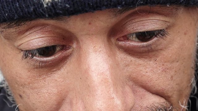 Close-up of an homeless begging for money on the street