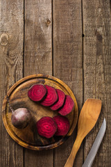 sliced on beetroot slate and wooden counter top background