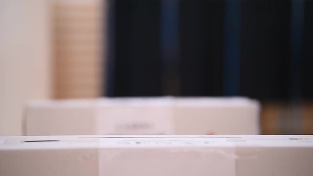 Unrecognizable people casting votes into the ballot box during elections