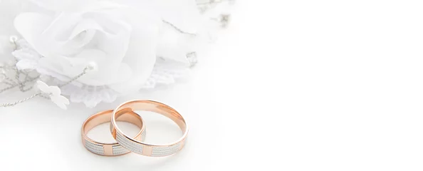 Wedding rings on wedding card on a white background, border design panoramic banner © ruslan_khismatov