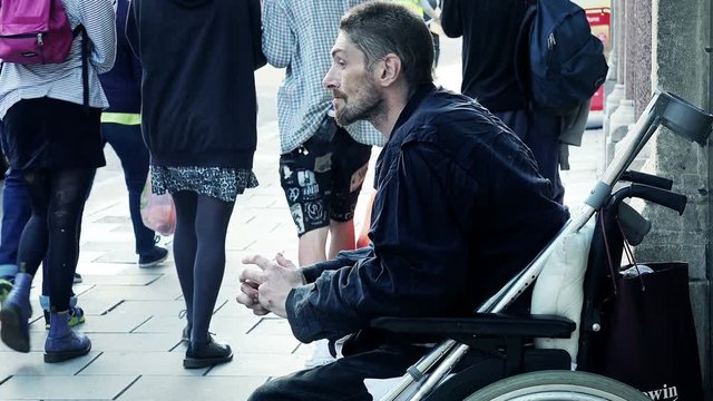 homeless on wheelchair asking for charity: asking food, coins, change, aid