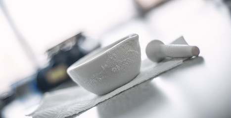 Frozen laboratory mortar after experiment with liquid nitrogen