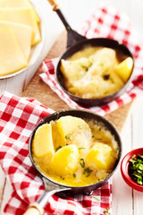 Traditional raclette cheese and potato dinner