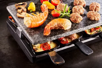 Zelfklevend Fotobehang Tasty prawn tails cooking on a raclette grill © exclusive-design