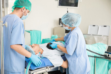 Doctors giving CPR to a patient