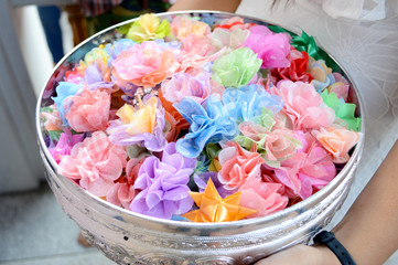 Alms flowers, almsgiving with flowers, Thai culture.