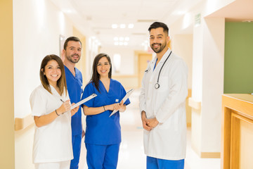 Doctor and residents standing in a hospital hallway