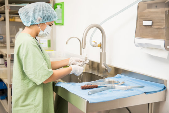 Woman sterilizing medical instruments