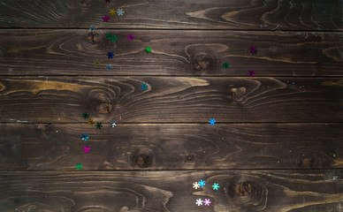 colorful snowflakes on the wooden background