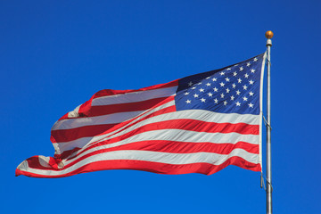 USA flag waving in clear sky