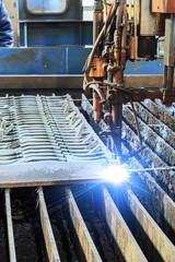 Oxygen torch cuts steel sheet.