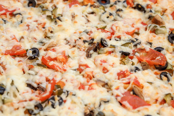 Cheeze pizza with tomatoes, closeup, macro