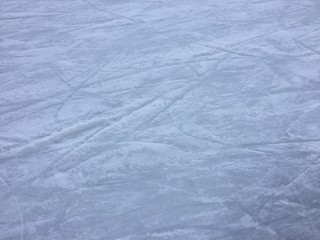Background of light ice in skate scratches, abstract texture surface