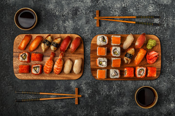 Sushi Set: sushi and sushi rolls on wooden plate.