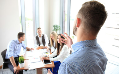 Businessman giving a presentation. Teamwork concept