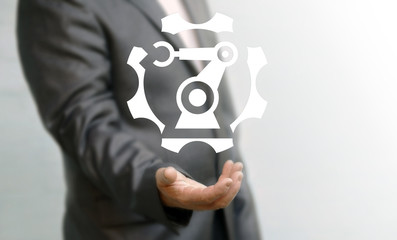 Industrial business automation robotic manufacture service support concept. Man offers gear manufacturing mechanical robot arm hand manipulator icon. Industry 4.0 repair cogwheel technology