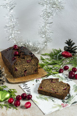 Fototapeta na wymiar Banana bread with cranberries and almond. Christmas cake. Christmas decoration. White background.