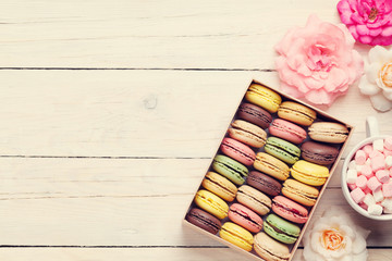 Colorful macaroons in a box and marshmallow