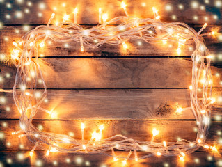 Christmas decoration background - vintage planked wood with ligh